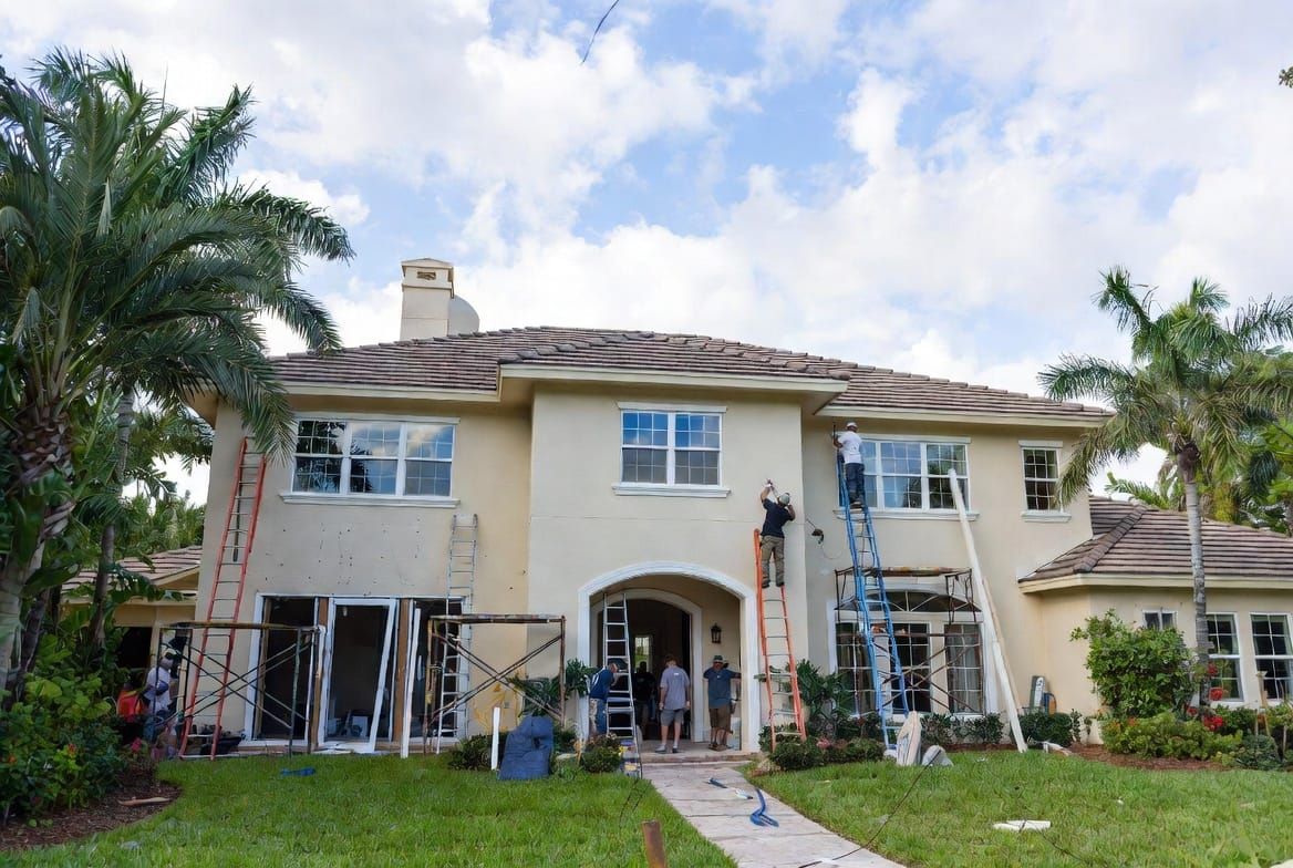 Professional crew installing impact doors on Florida home