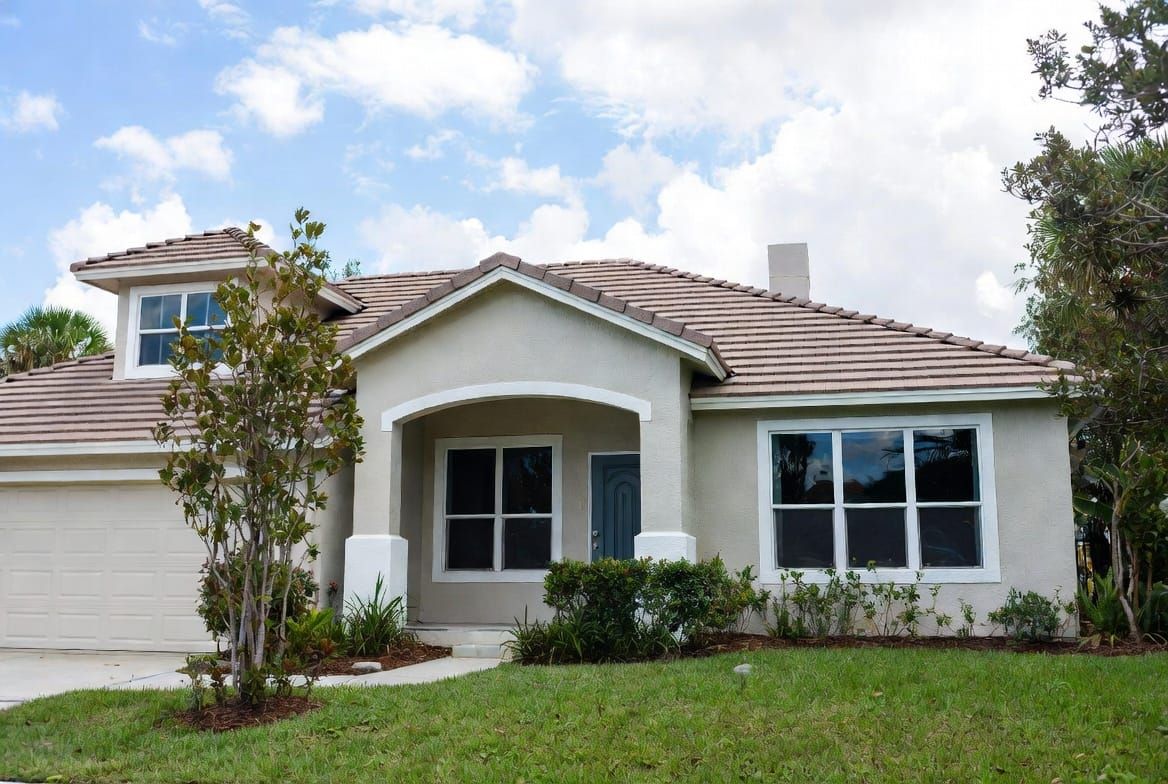 Installation crew installing impact windows on residential home